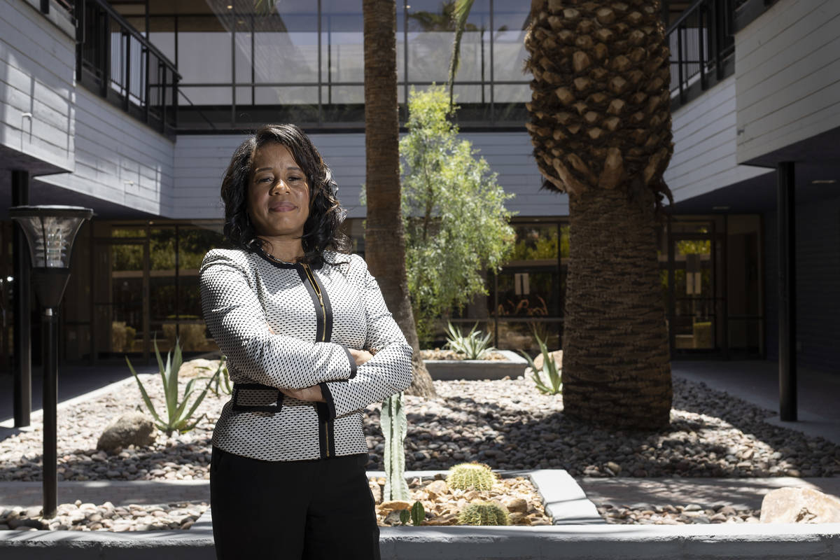 Lydia High, owner of Precise Business Management, stands for a portrait outside her business on ...