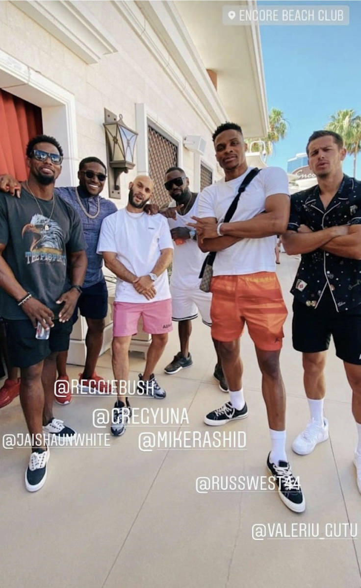 Reggie Bush, second from left; and Russell Westbrook, second from right; are shown with friends ...