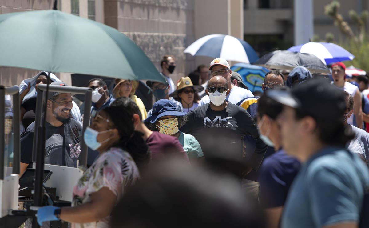 People wait in line at the Nevada Department of Motor Vehicles at 8250 West Flamingo Road, whic ...