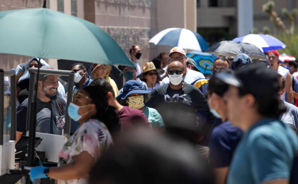 People wait in line at the Nevada Department of Motor Vehicles at 8250 West Flamingo Road, whic ...