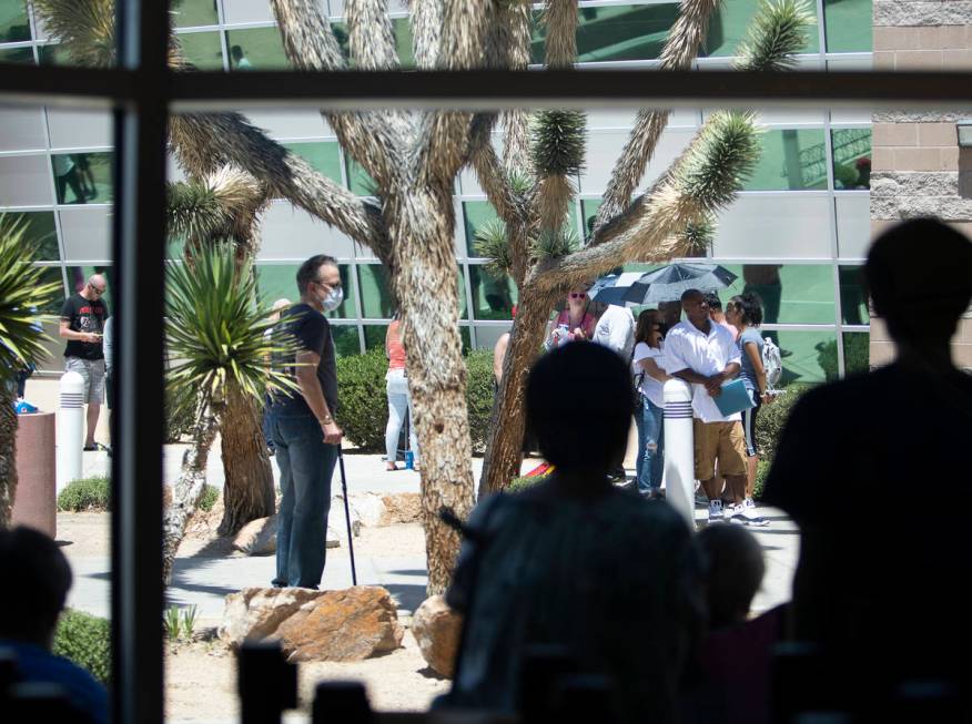 The Nevada Department of Motor Vehicles at 8250 West Flamingo Road has extremely long lines as ...