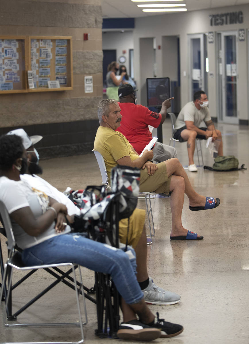 Some patrons wore masks while others refrained at the Nevada Department of Motor Vehicles at 82 ...