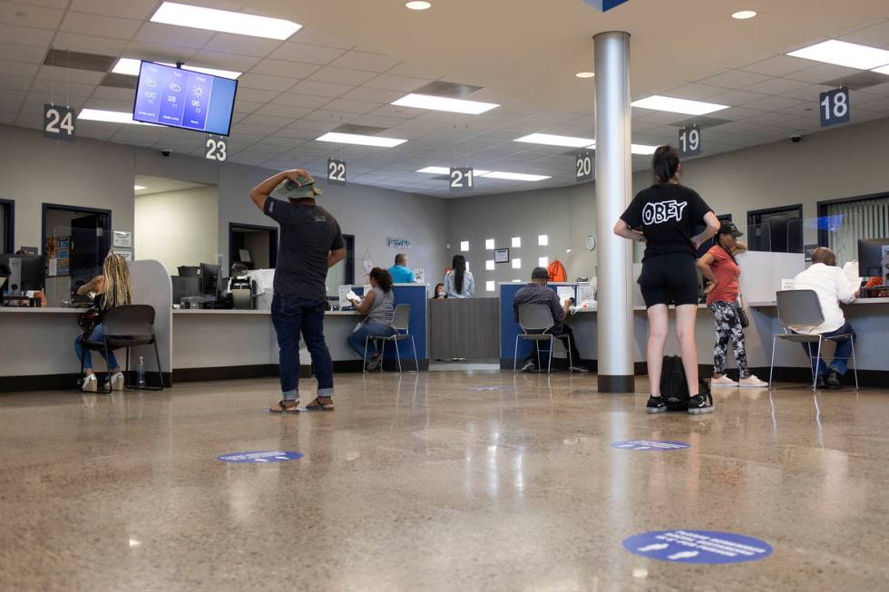 People near the finish line after long wait times at the Nevada Department of Motor Vehicles at ...