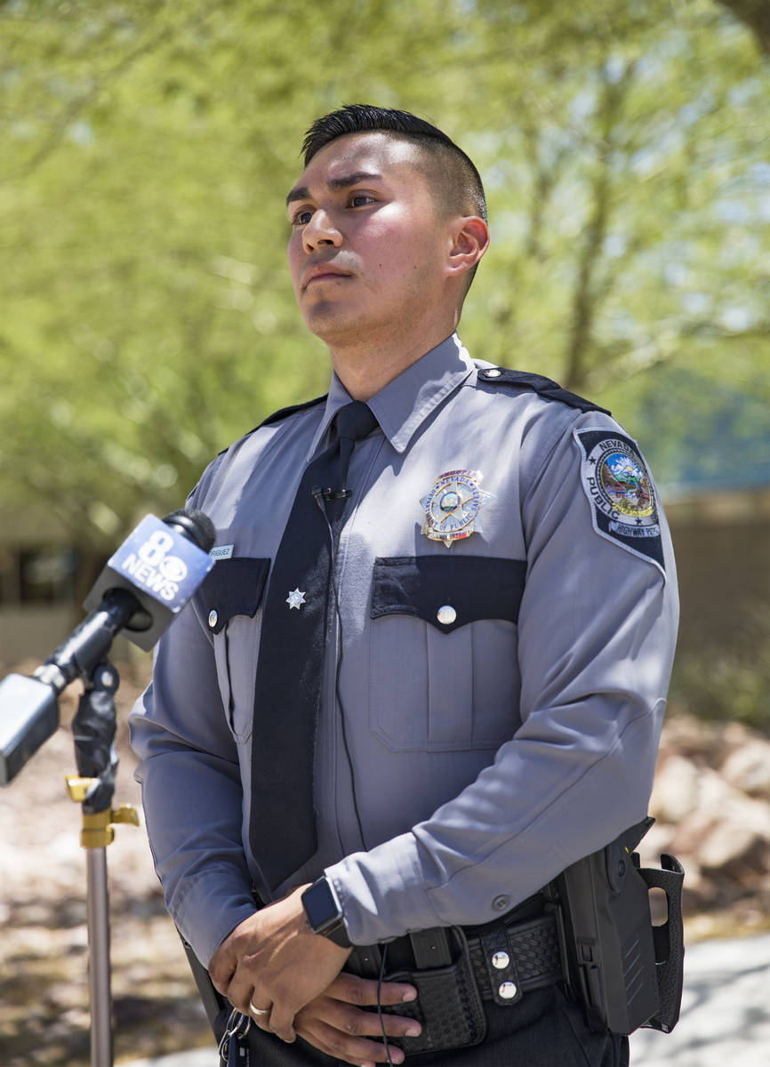 Nevada Highway Patrol Trooper Rafael Rodriguez speaks to the media about how he saved a woman w ...