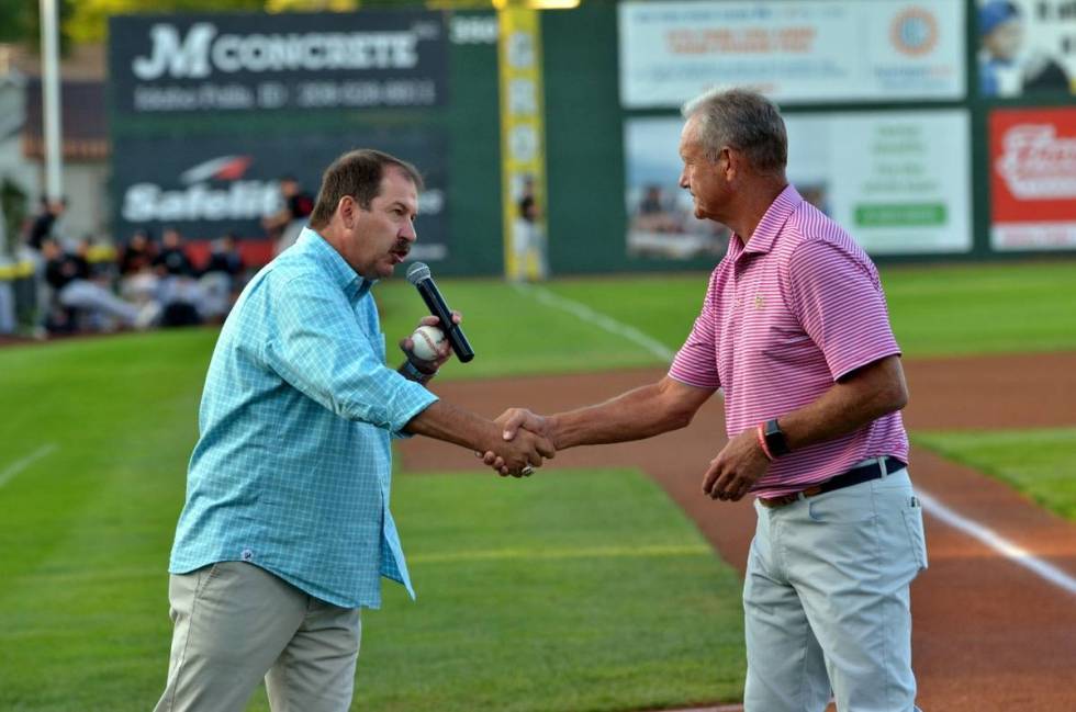 Kevin Greene, general manager of the Pioneer League's Idaho Falls Chukars, shakes the hand of H ...