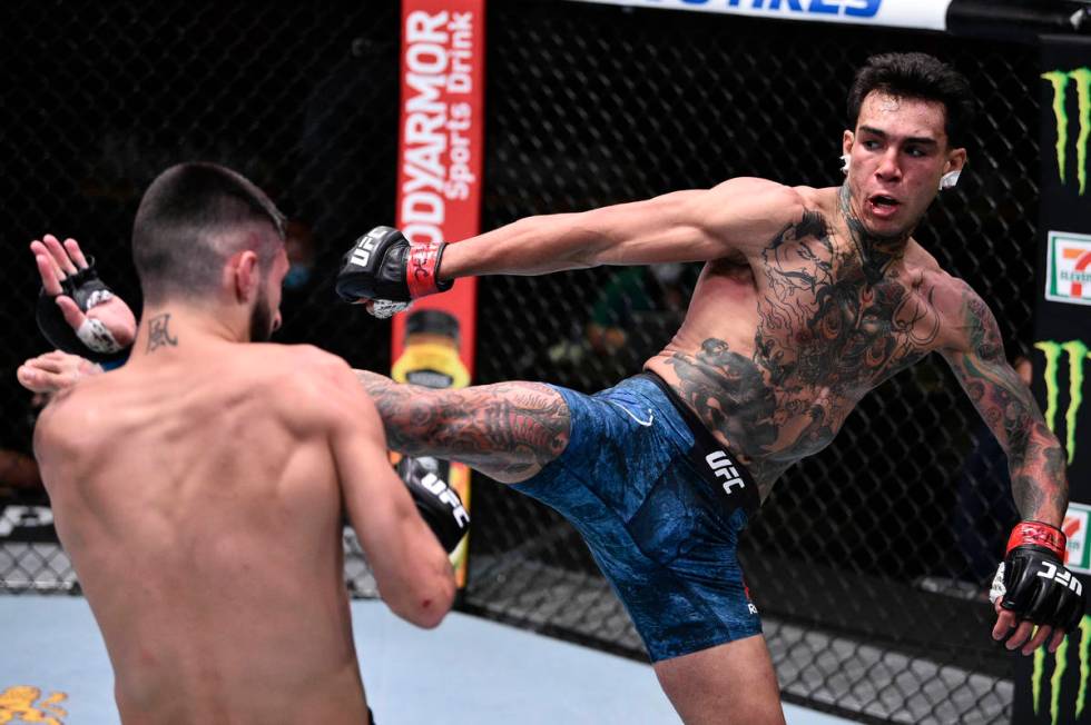 Andre Fili kicks Charles Jourdain of Canada in their featherweight fight during the UFC Fight N ...