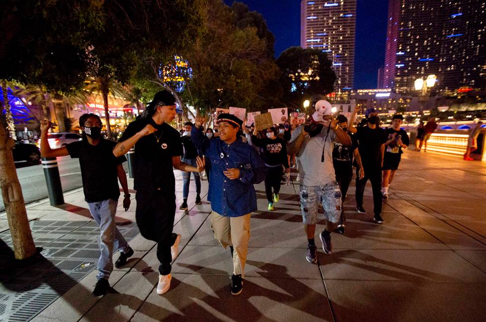 Protesters begin marching down the Strip starting at Bellagio in Las Vegas on Monday, June 15, ...