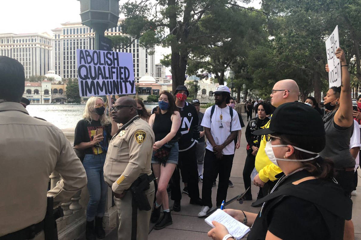 About 20 protesters gather Monday, June 15, 2020, outside Bellagio on the Las Vegas Strip. (Jam ...