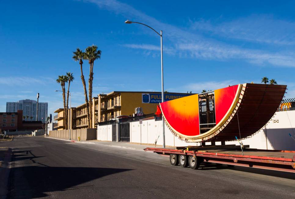 The first piece of the Hard Rock Cafe guitar sign sits outside of the Neon Museum before being ...