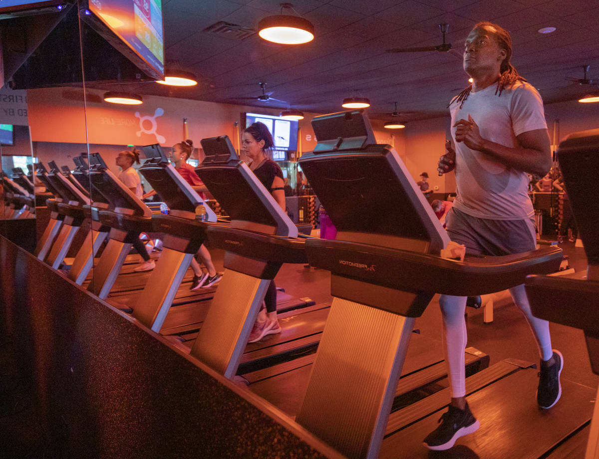 Orangetheory Fitness members practice social distancing by using every other treadmill at the O ...