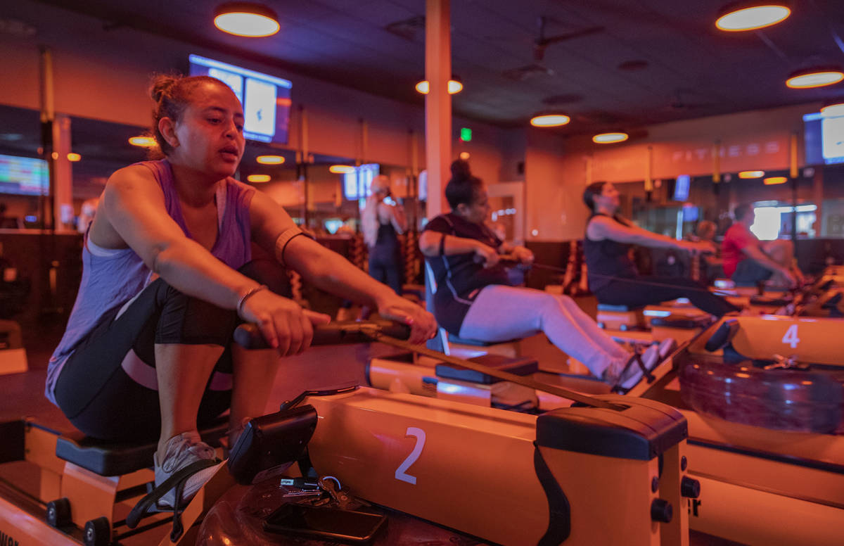 Orangetheory Fitness member Rachel Demissie participates in the rowing circuit at the Orangethe ...