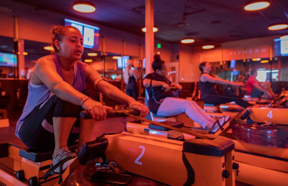 Orangetheory Fitness member Rachel Demissie participates in the rowing circuit at the Orangethe ...