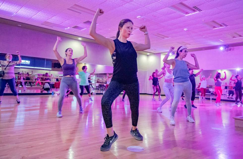 Life Time Fitness members practice social distancing while participating in a Zumba class at th ...