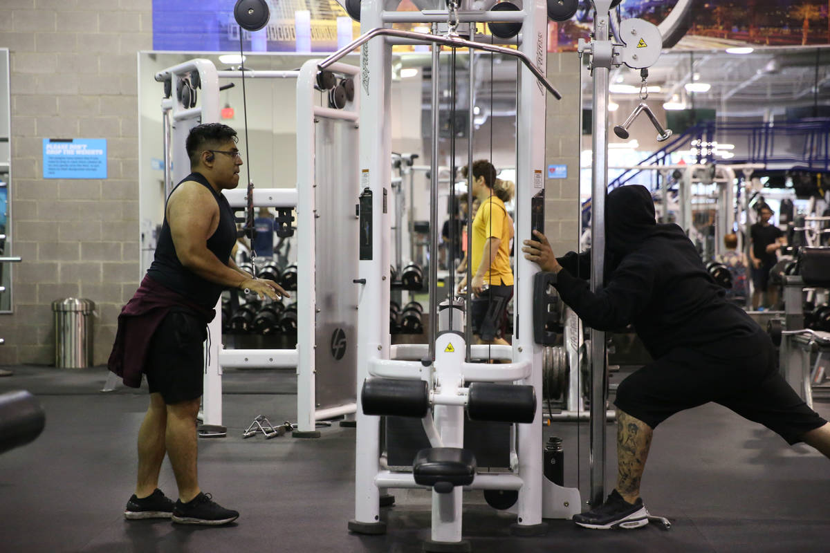 People workout at the EOS Fitness gym in Henderson, Tuesday, June 16, 2020. (Erik Verduzco / La ...