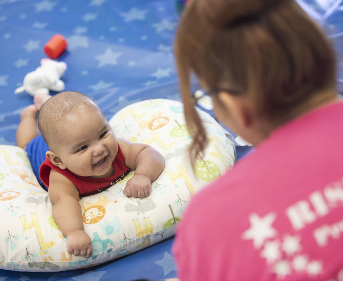 Lorenzo smiles at Miss Brenda at Rising Star Preschool & Childcare on Tuesday, June 16, 202 ...