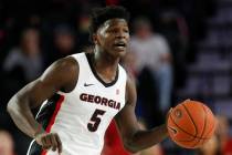 In this Friday, Oct. 18, 2019, file photo, Georgia's Anthony Edwards (5) dribbles the ball up d ...