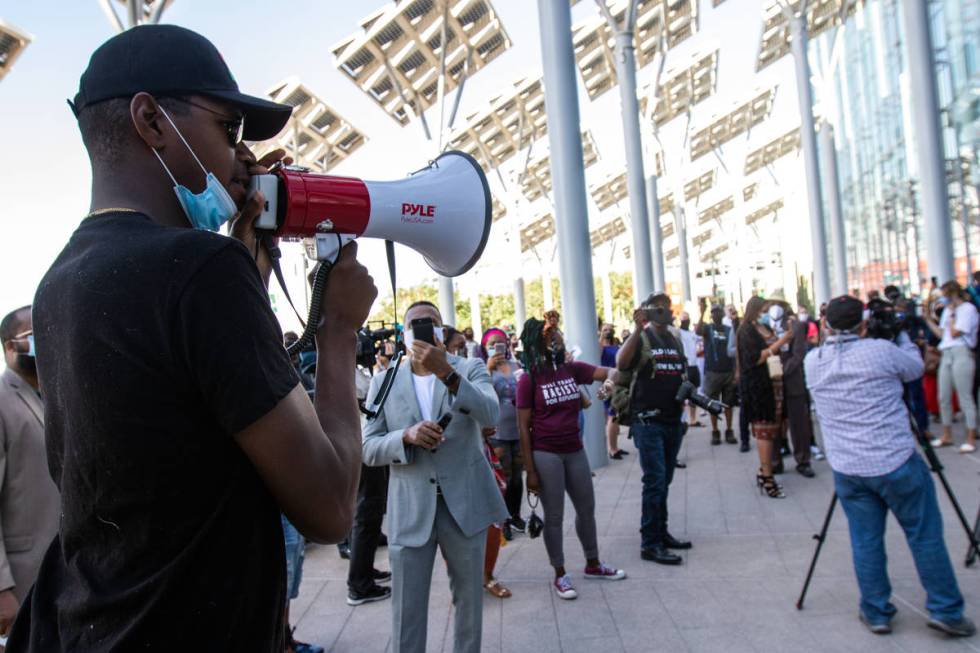 The Rev. Stretch Sanders leads the crowd in a chant saying "Michele Fiore has got to go" in fro ...