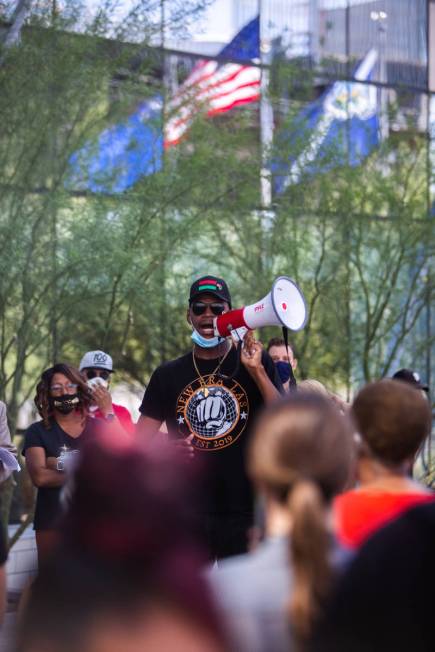 The Rev. Stretch Sanders speaks to protesters at an NAACP protest in front of Las Vegas City Ha ...