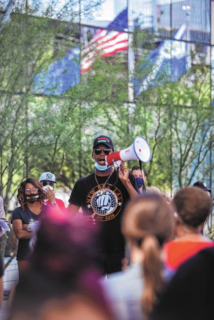 The Rev. Stretch Sanders speaks to protesters at an NAACP protest in front of Las Vegas City Ha ...