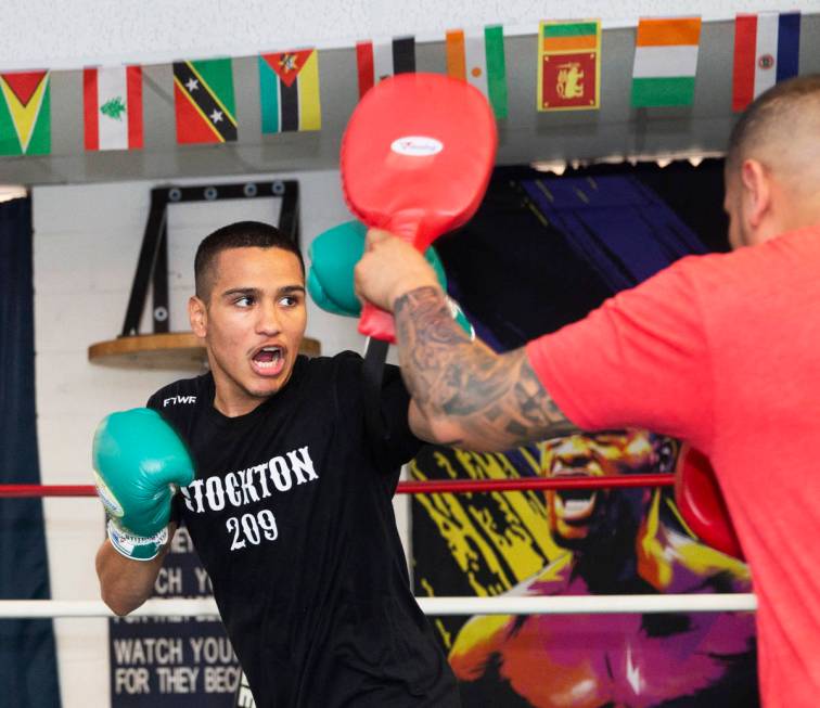 Gabe Flores Jr., left, works out at Capetillo & TM Boxing on Saturday, June 13, 2020, in La ...