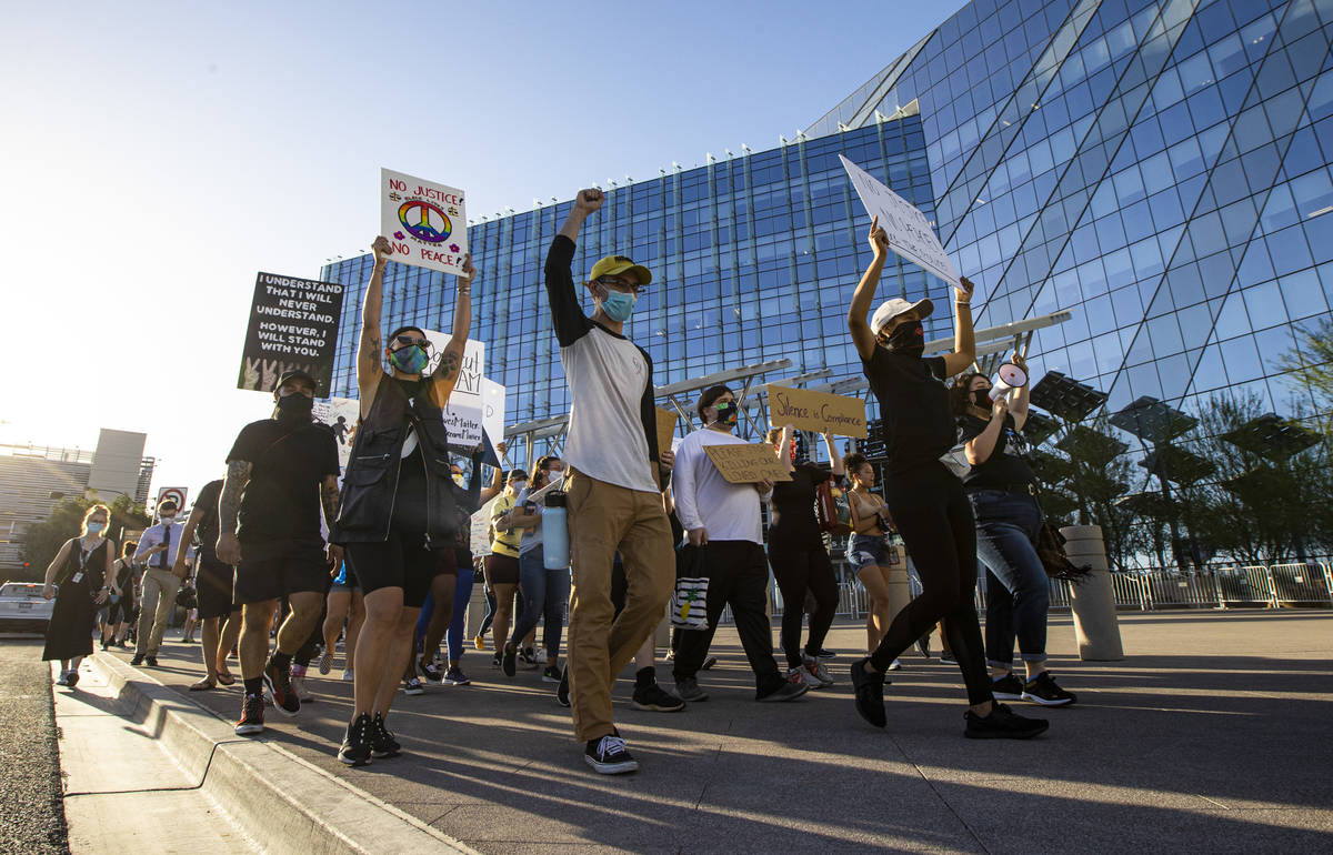 People participate in a Black Lives Matter protest outside of Las Vegas City Hall on Wednesday, ...