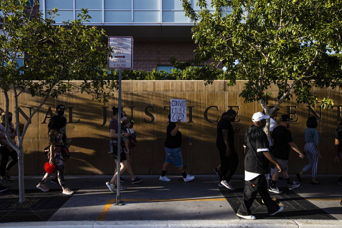 People participate in a Black Lives Matter protest outside of Las Vegas City Hall on Wednesday, ...
