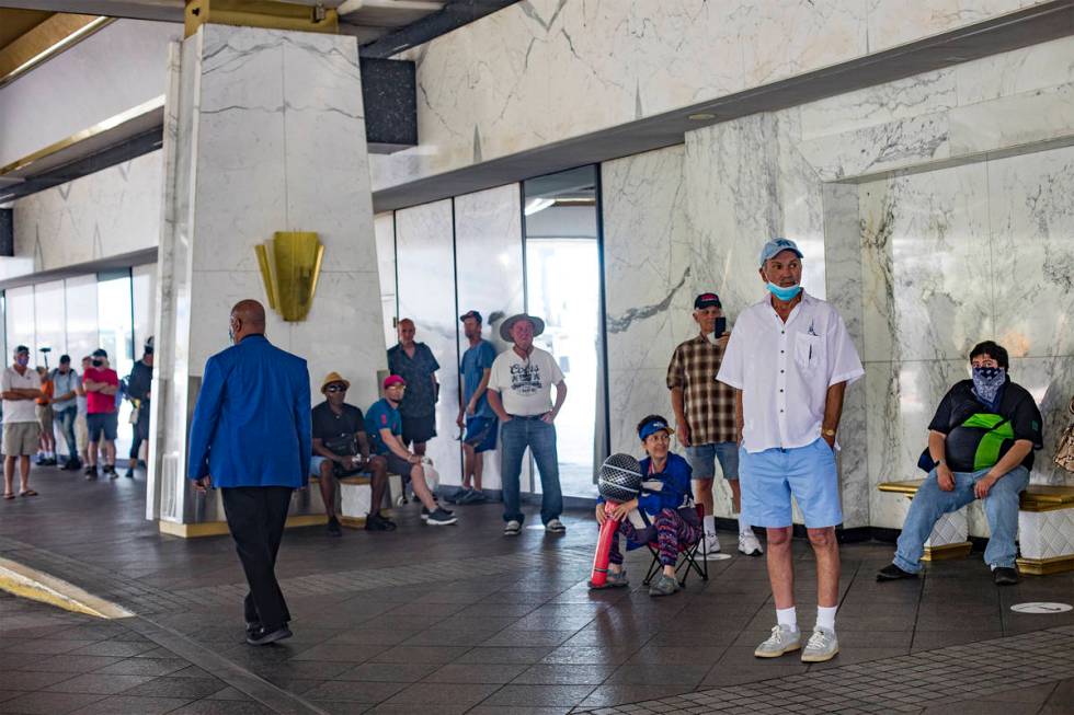 Guests wait in line for the reopening of the Westgate after the months long coronavirus closure ...