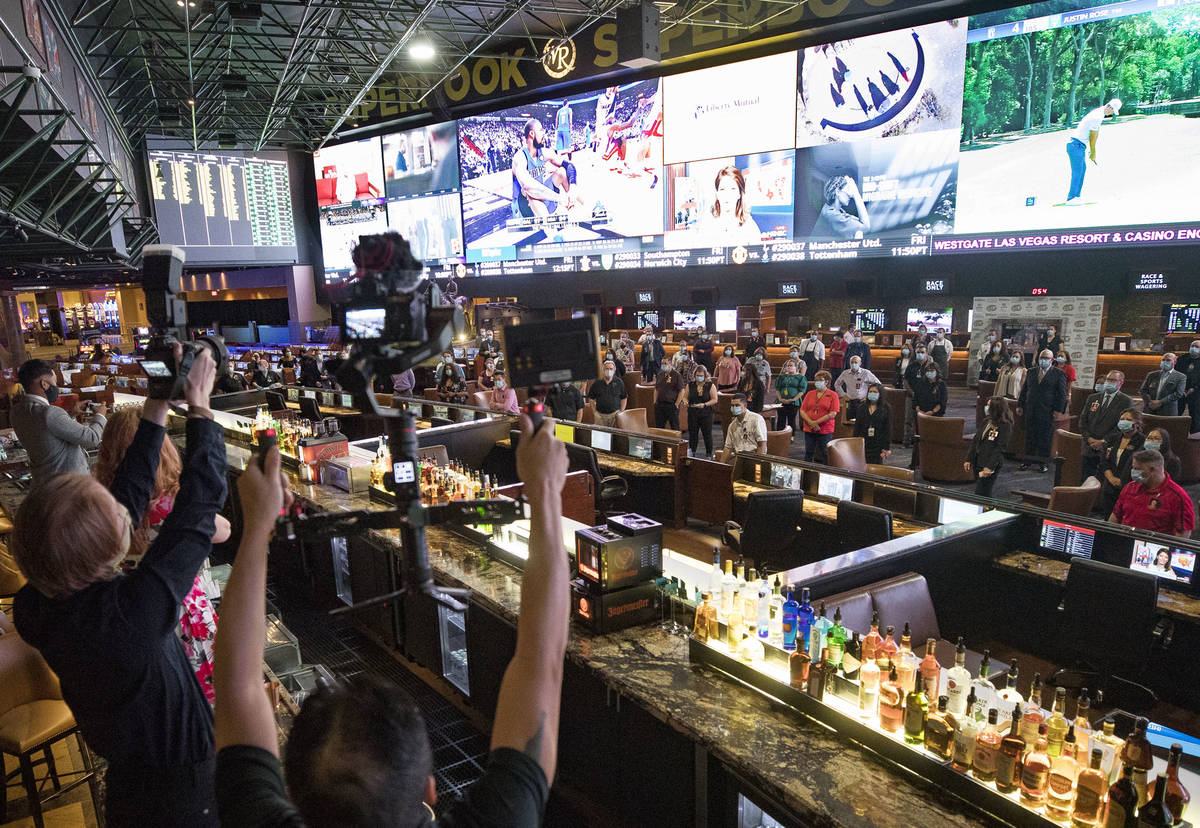 Employees gather for a photo before the reopening of the Westgate after the months long coronav ...