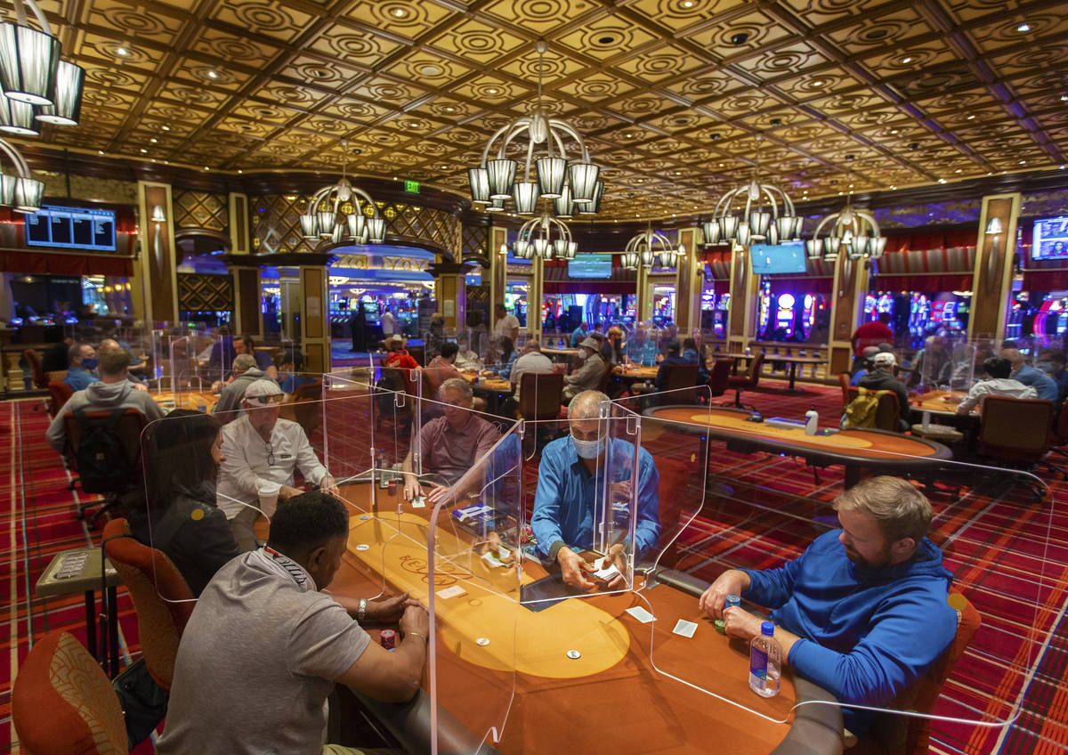 The Bellagio poker room is packed after being outfitted with shielding and upgraded sanitation ...