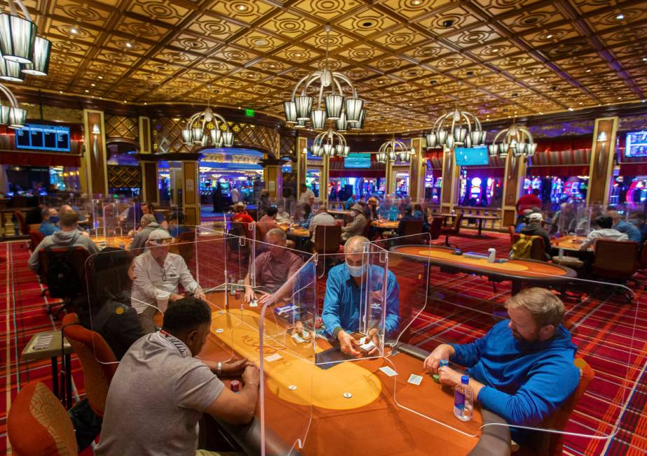 The Bellagio poker room is packed after being outfitted with shielding and upgraded sanitation ...