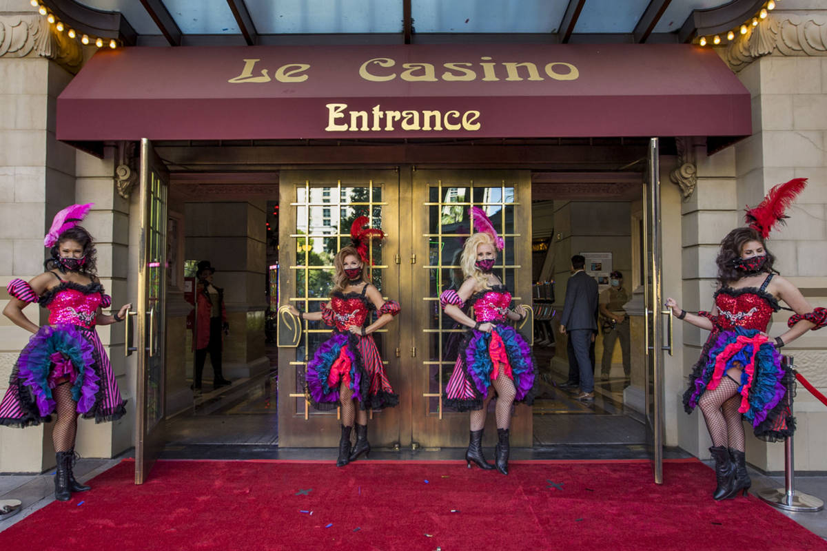 French-inspired can-can dancers stand outside the entrance of the Paris Las Vegas ready to welc ...