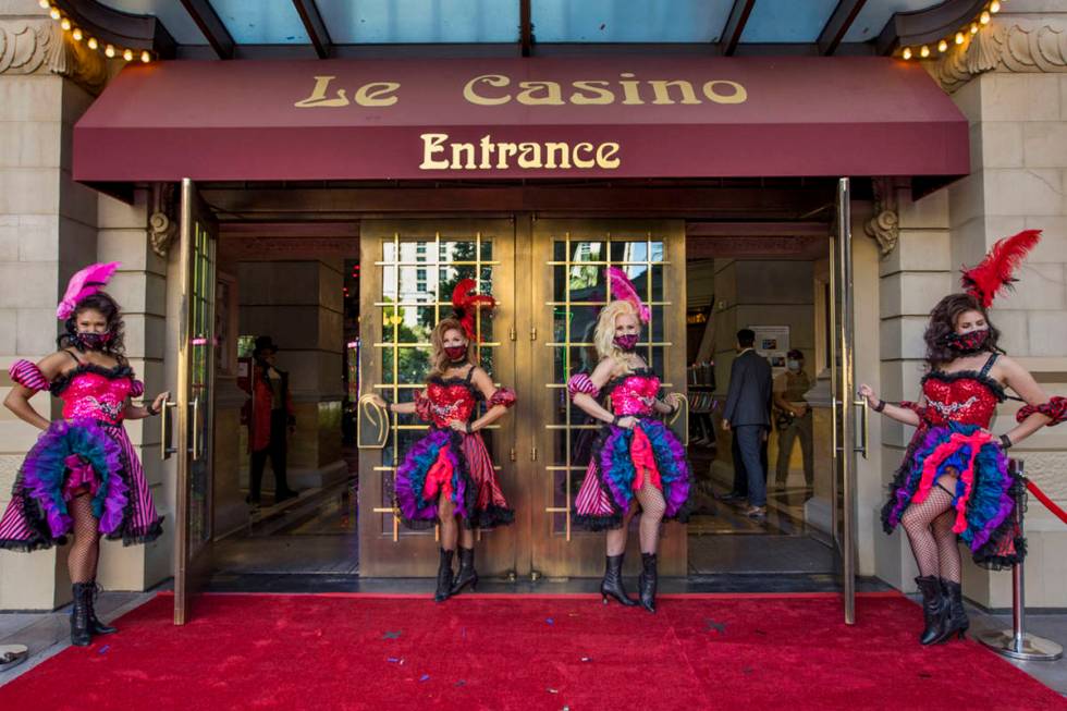 French-inspired can-can dancers stand outside the entrance of the Paris Las Vegas ready to welc ...