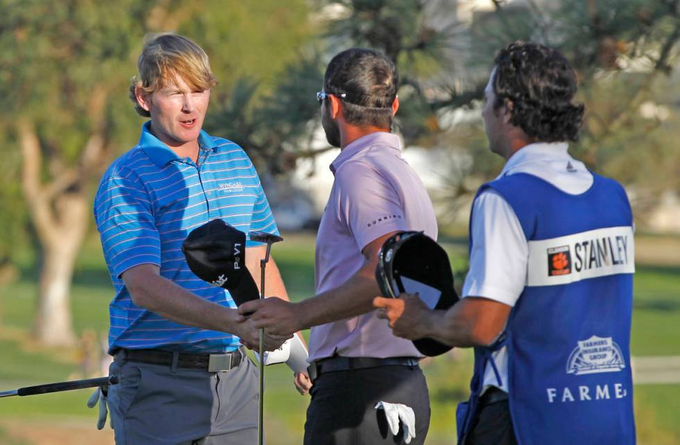 Brandt Snedeker, left, is congratulated by Kyle Stanley after beating Stanley on the second pla ...