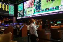 Jay Kornegay, vice president of Westgate Sportsbook, makes a phone call on the first day of the ...