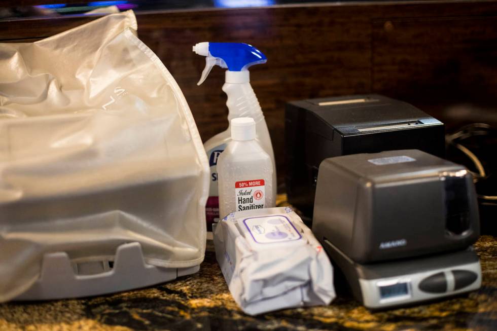Cleaning supplies on the Westgate Sportsbook counter on the first day of the casino reopening a ...