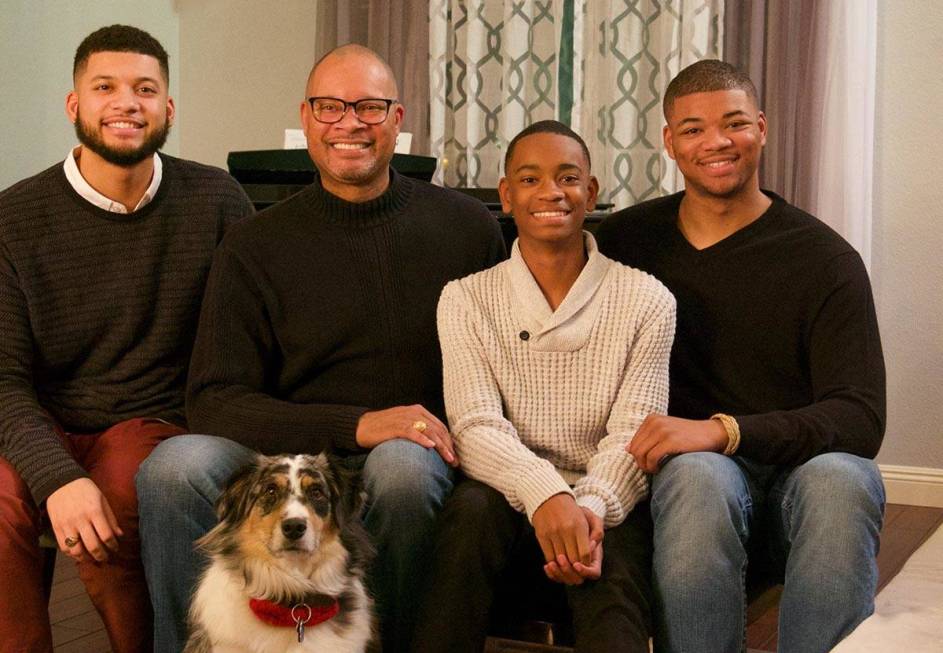 Nevada Attorney General Aaron Ford, second from left, sits with his sons, from left, Avery, Ale ...