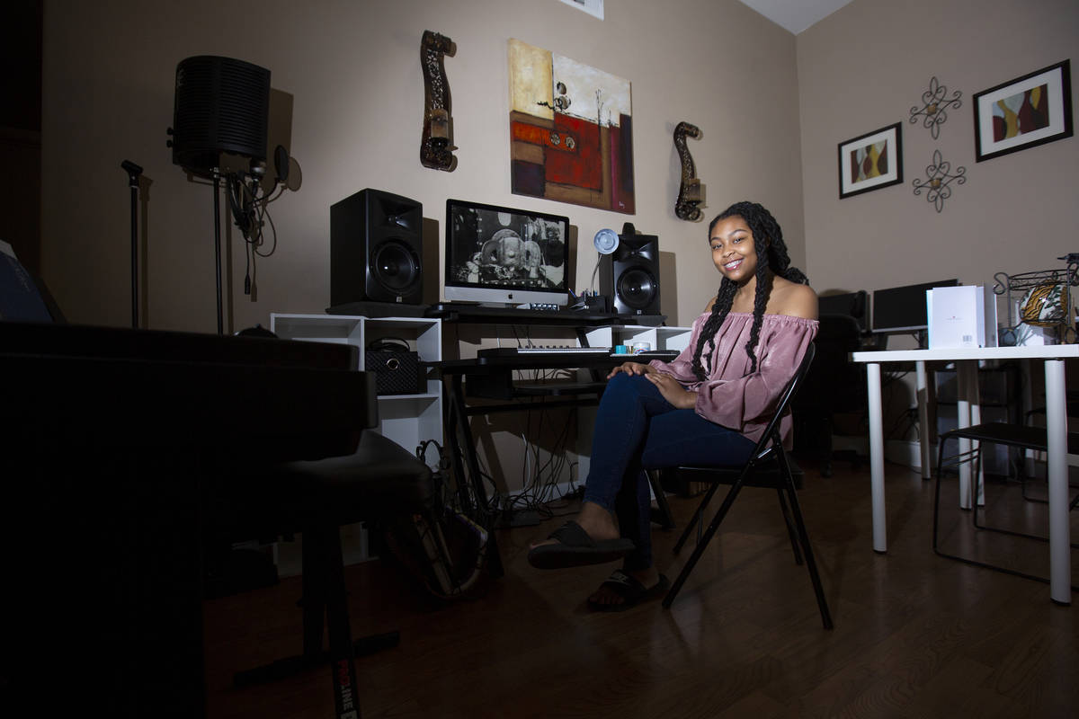 A'Kaeila Coulter, a student at Leadership Academy of Nevada, sits at the computer in her home w ...