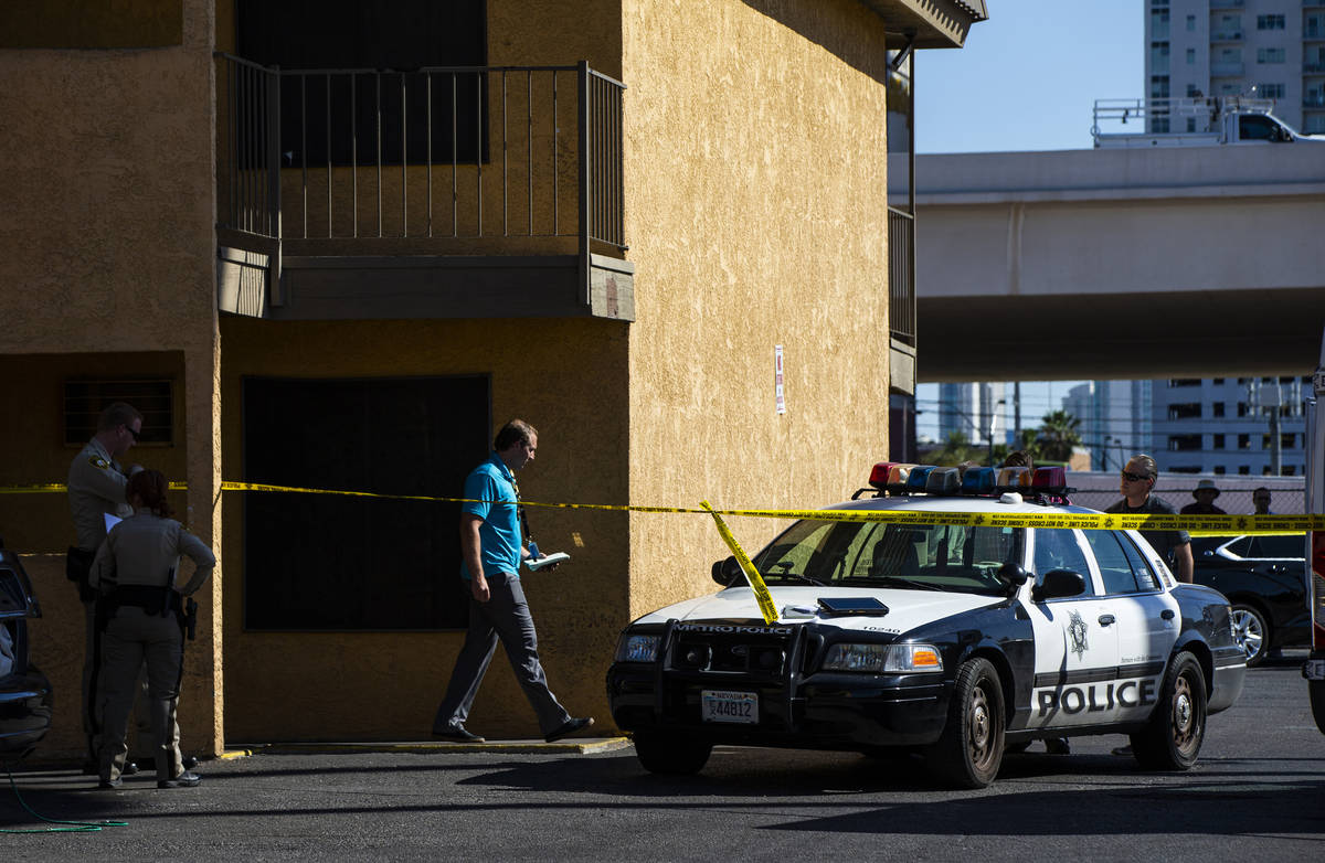 Las Vegas police investigate the scene of a homicide around a Siegel Suites at Bonanza Road and ...