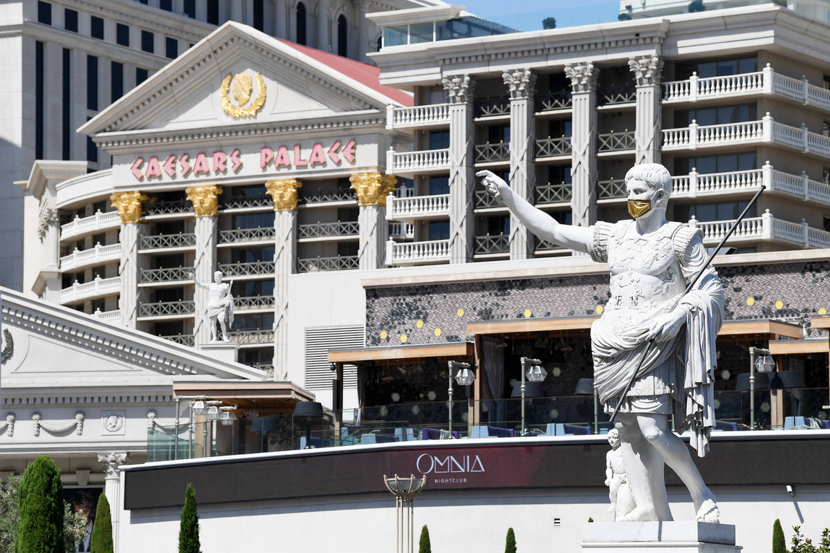The masked Caesars statue is shown outside Caesars Palace on Thursday, June 4, 2020. (Denise Tr ...