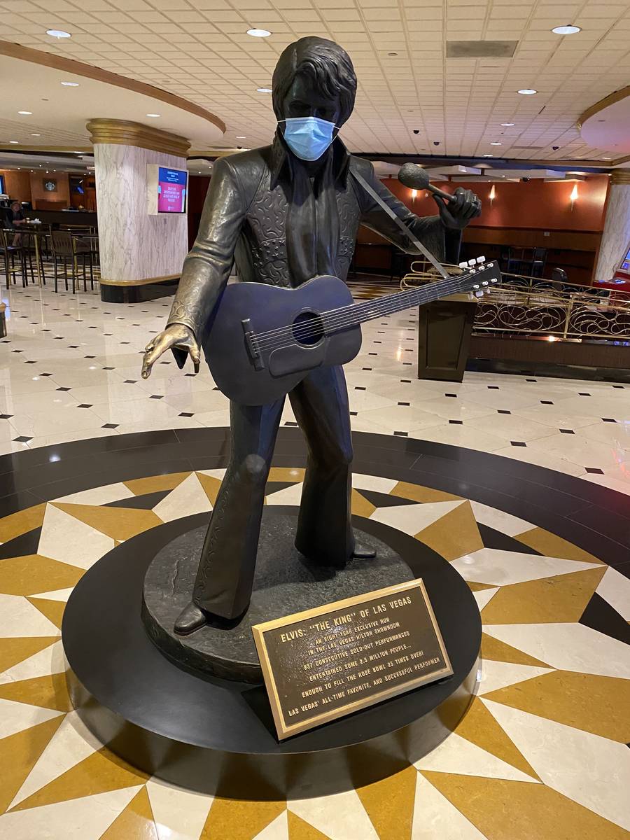 A masked statue of Elvis Presley is shown at Westgate Las Vegas on Thursday, June 18, 2020. (Jo ...