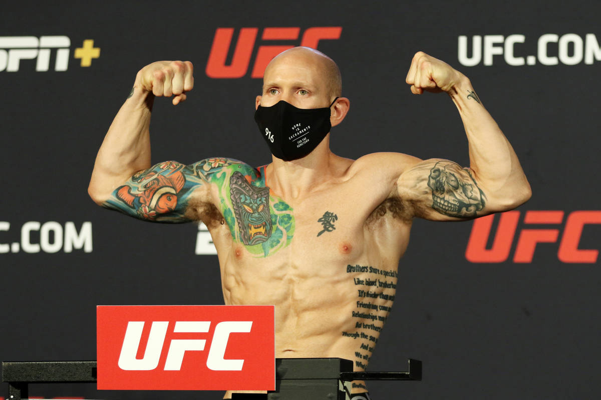 UFC featherweight Josh Emmett poses on the scale during weigh-ins at the UFC Apex in Las Vegas, ...