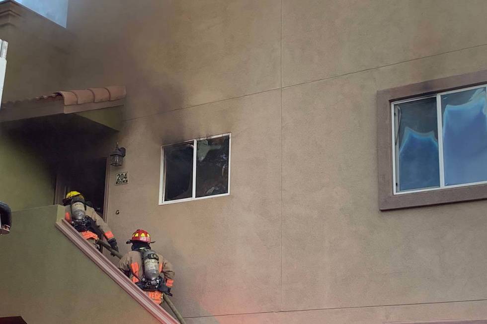 Firefighters with Las Vegas Fire Department put out a fire in an apartment at 1820 N. Decatur D ...