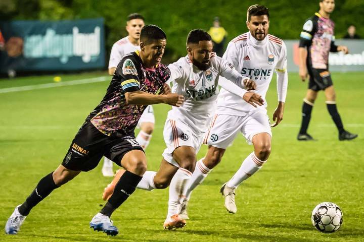 Junior Burgos of Lights FC pursues the ball during the team's only 2020 USL game before the cor ...