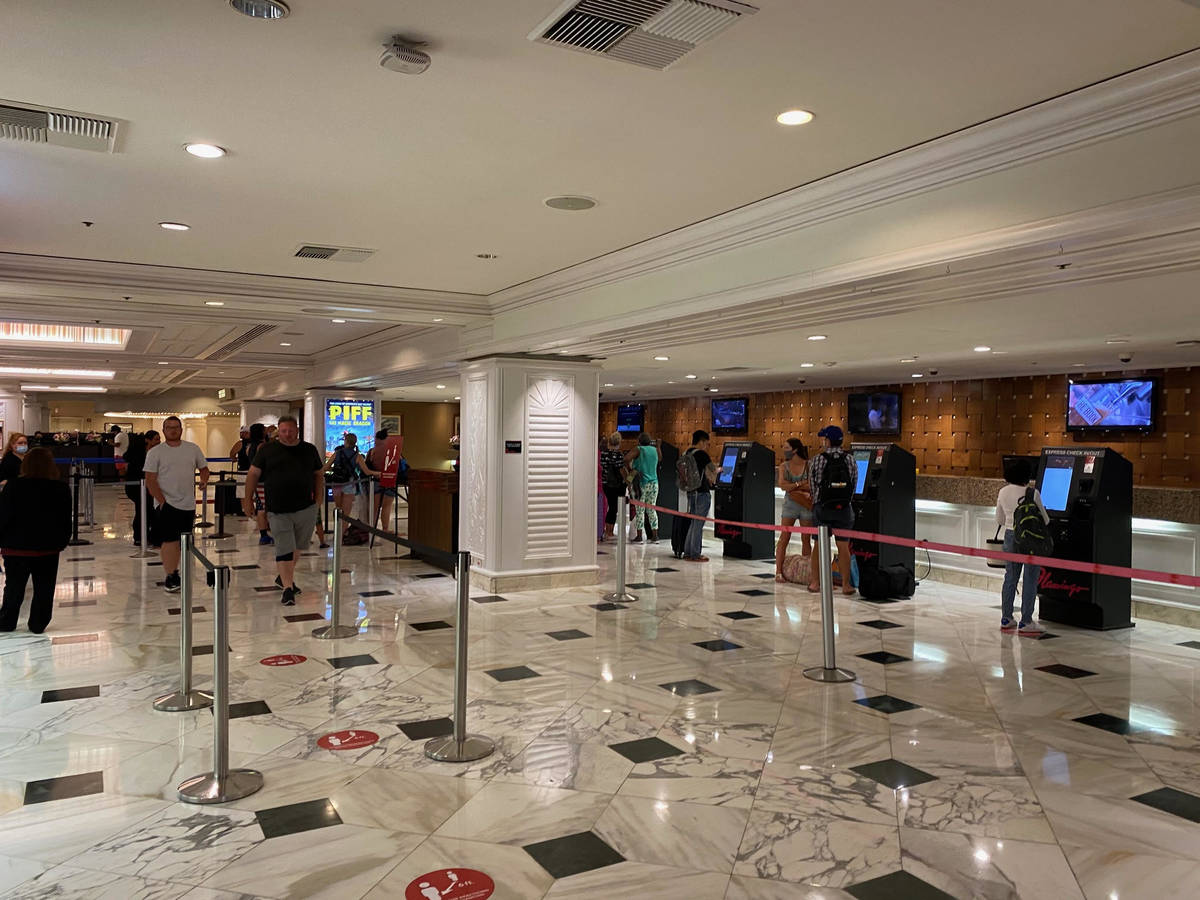 Guests wait to check in at the Flamingo. (Al Mancini/Las Vegas Review-Journal)