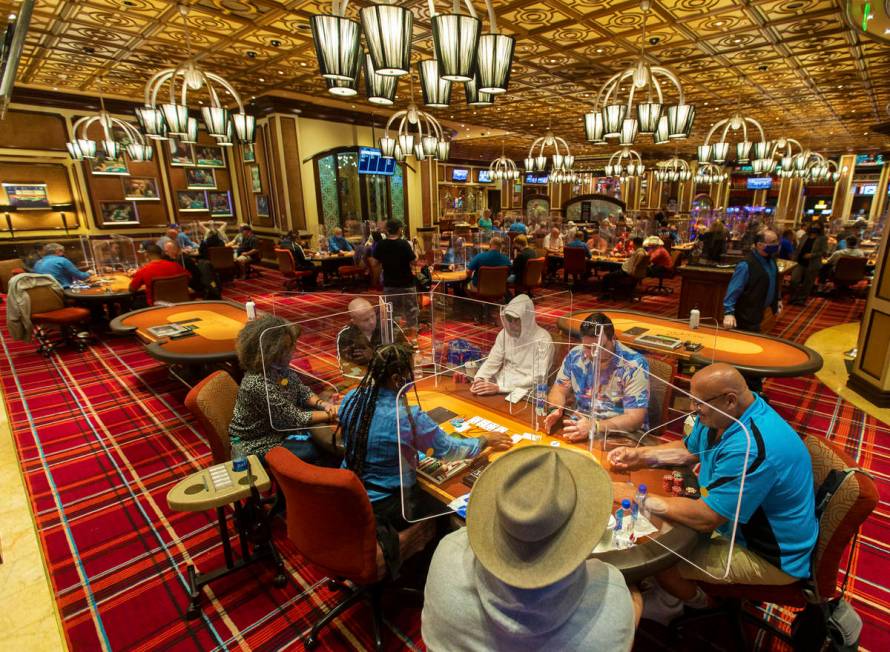 The Bellagio poker room is packed after being outfitted with shielding and upgraded sanitation ...