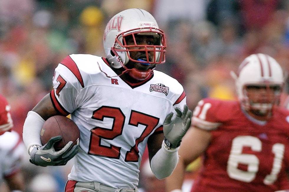 UNLV's Jamaal Brimmer (27) runs back a fumble recovery for 55-yard touchdown in front of Wiscon ...