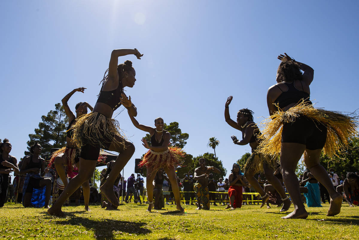 Members of Olabisi African Dance & Drum Ensemble perform during a Juneteenth event held by ...