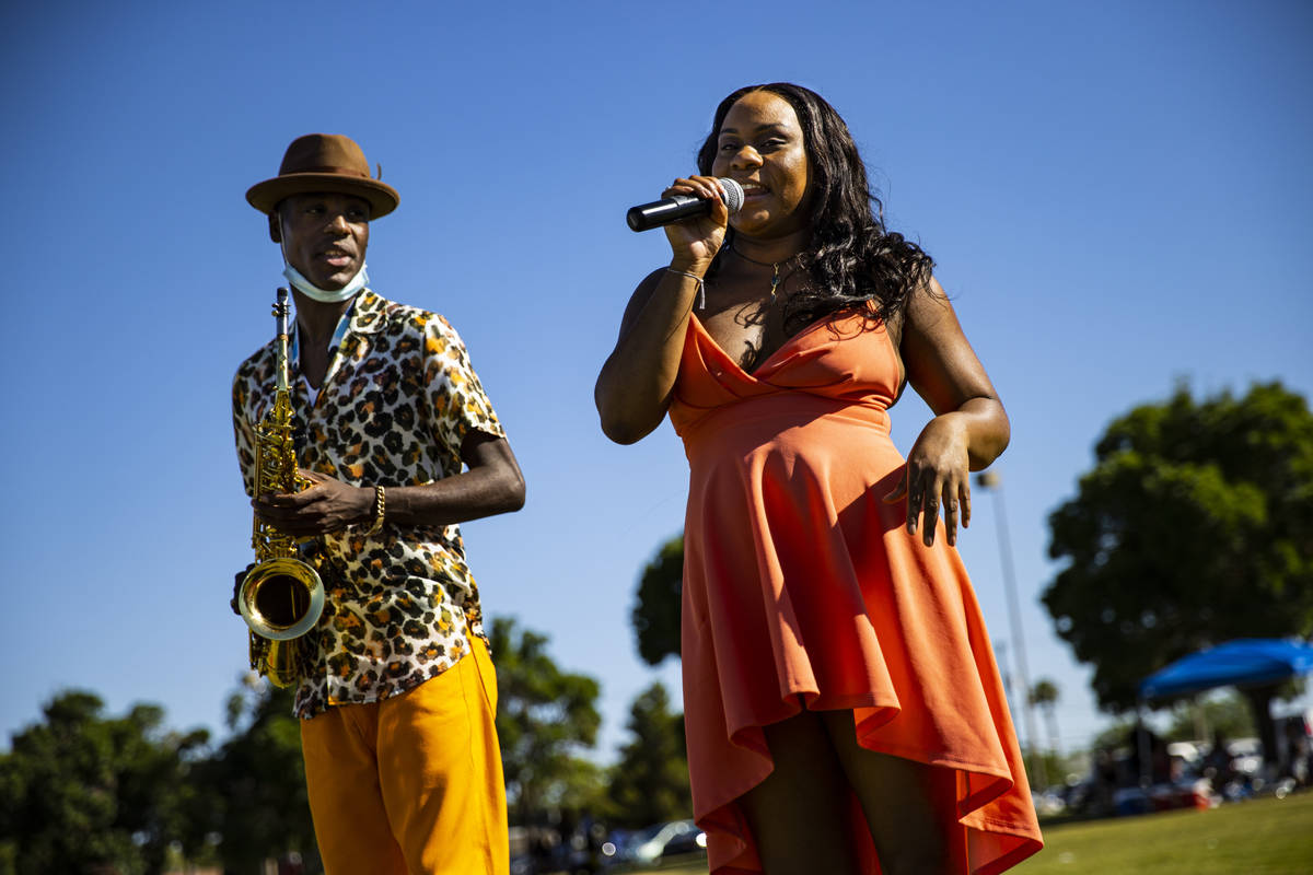 Jimi Duck, left, and Brittany Soul, of Las Vegas, perform during a Juneteenth event held by Sav ...