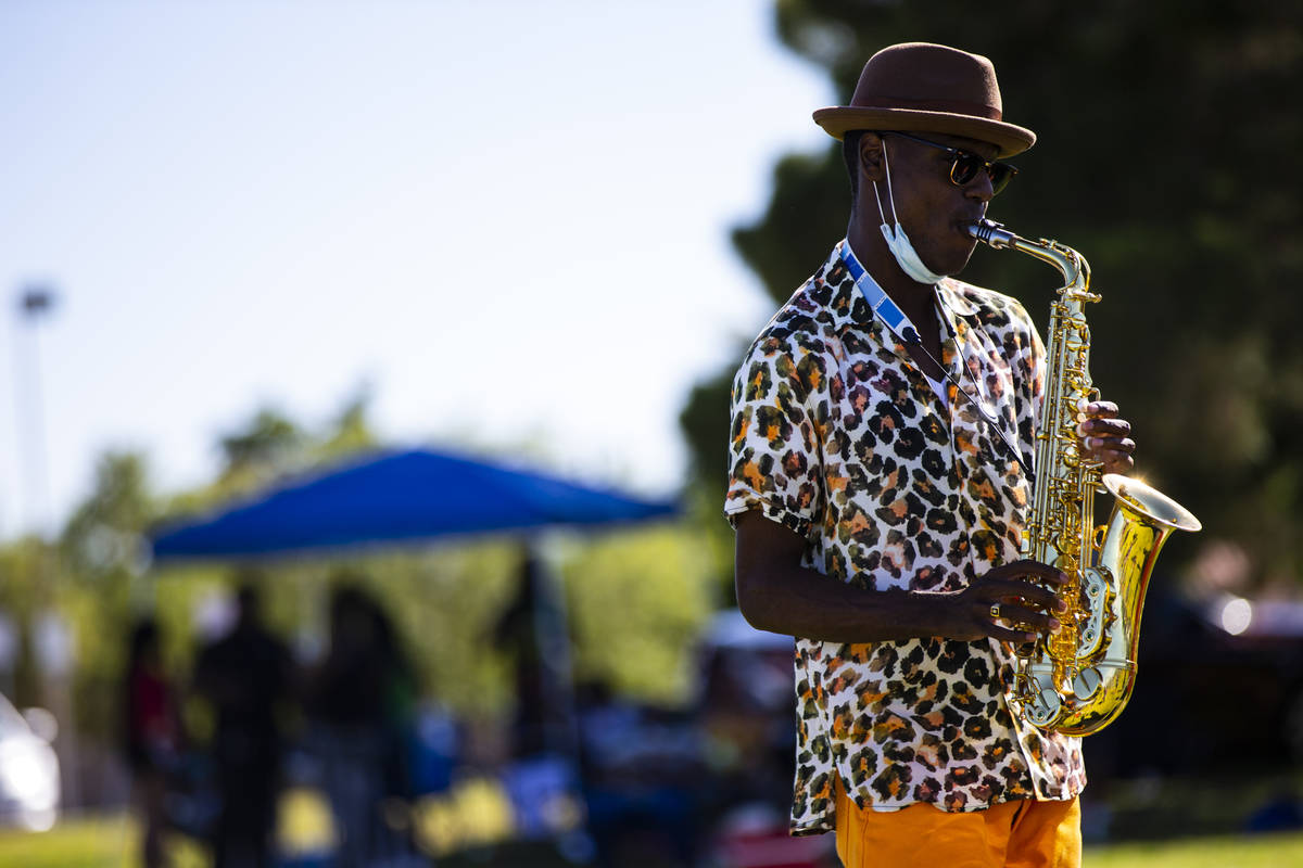 Jimi Duck performs during a Juneteenth event held by Save Our Sons at Lorenzi Park in Las Vegas ...