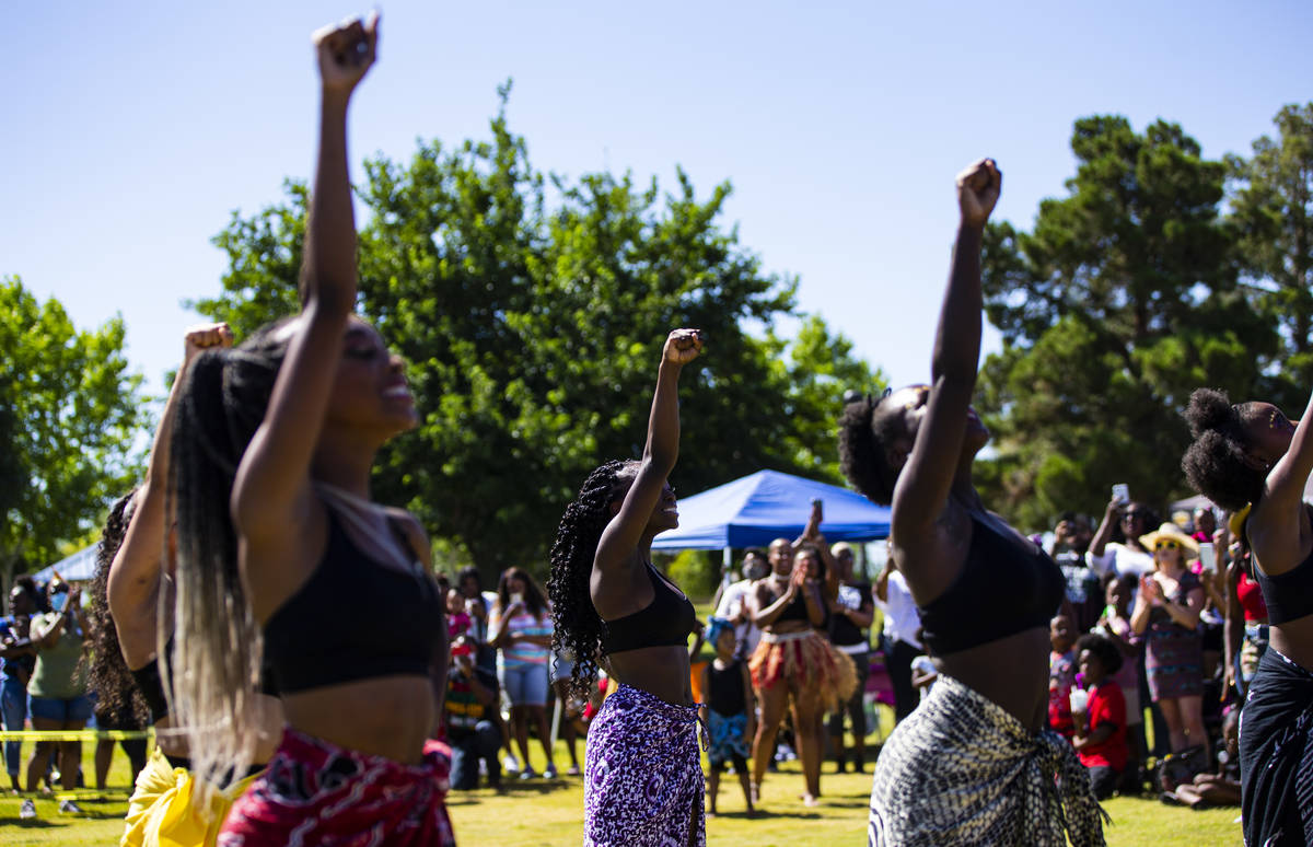 Members of Olabisi African Dance & Drum Ensemble perform during a Juneteenth event held by ...